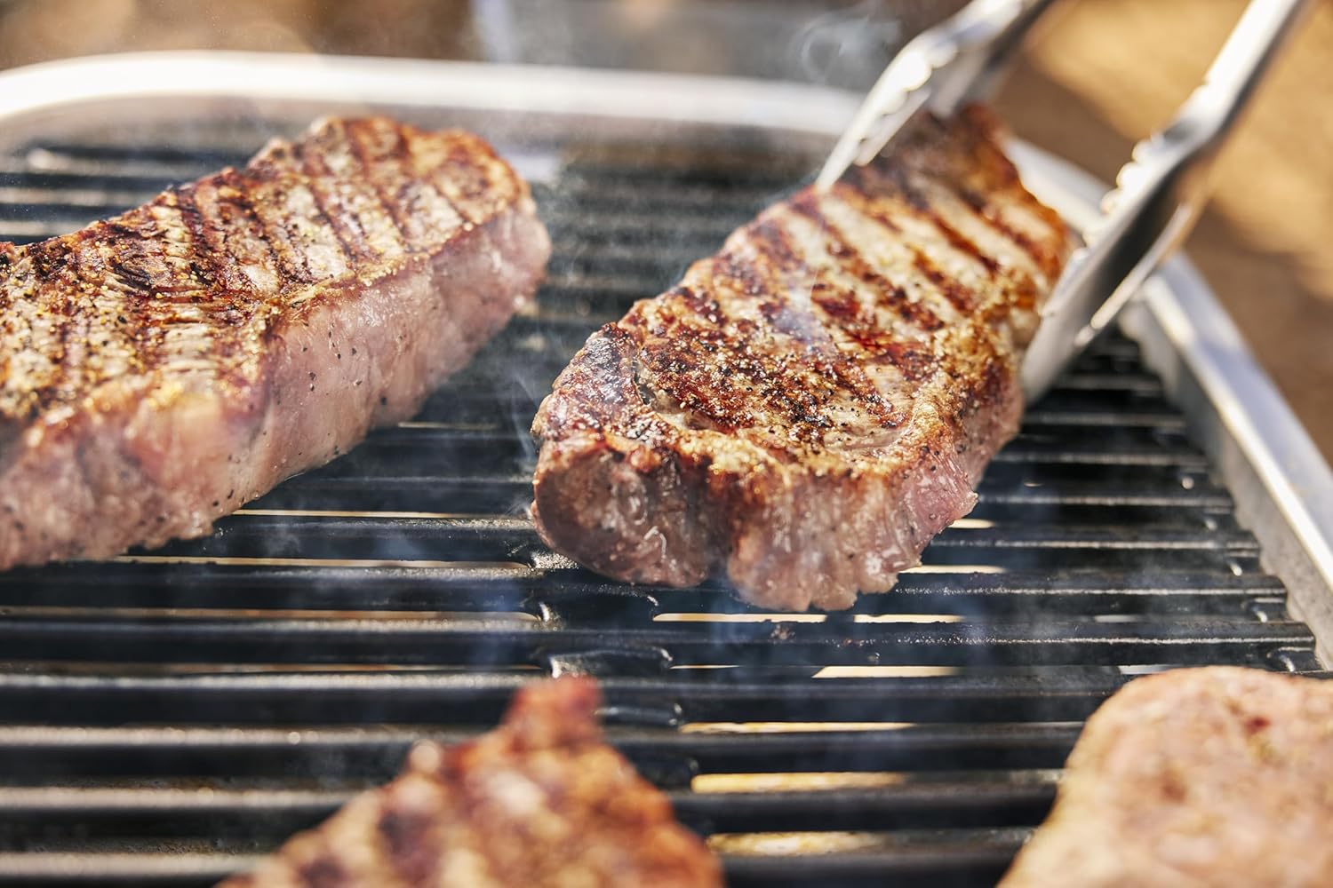Weber Lumin 92010879 Elektrogrill mit Stand-/Anbraten, Räuchern, Dünsten, Garen und Warmhalten, bis 315 °C, porzellanemaillierte Gusseisenroste, 33 x 49 cm Grillfläche, schwarz – Bild 12